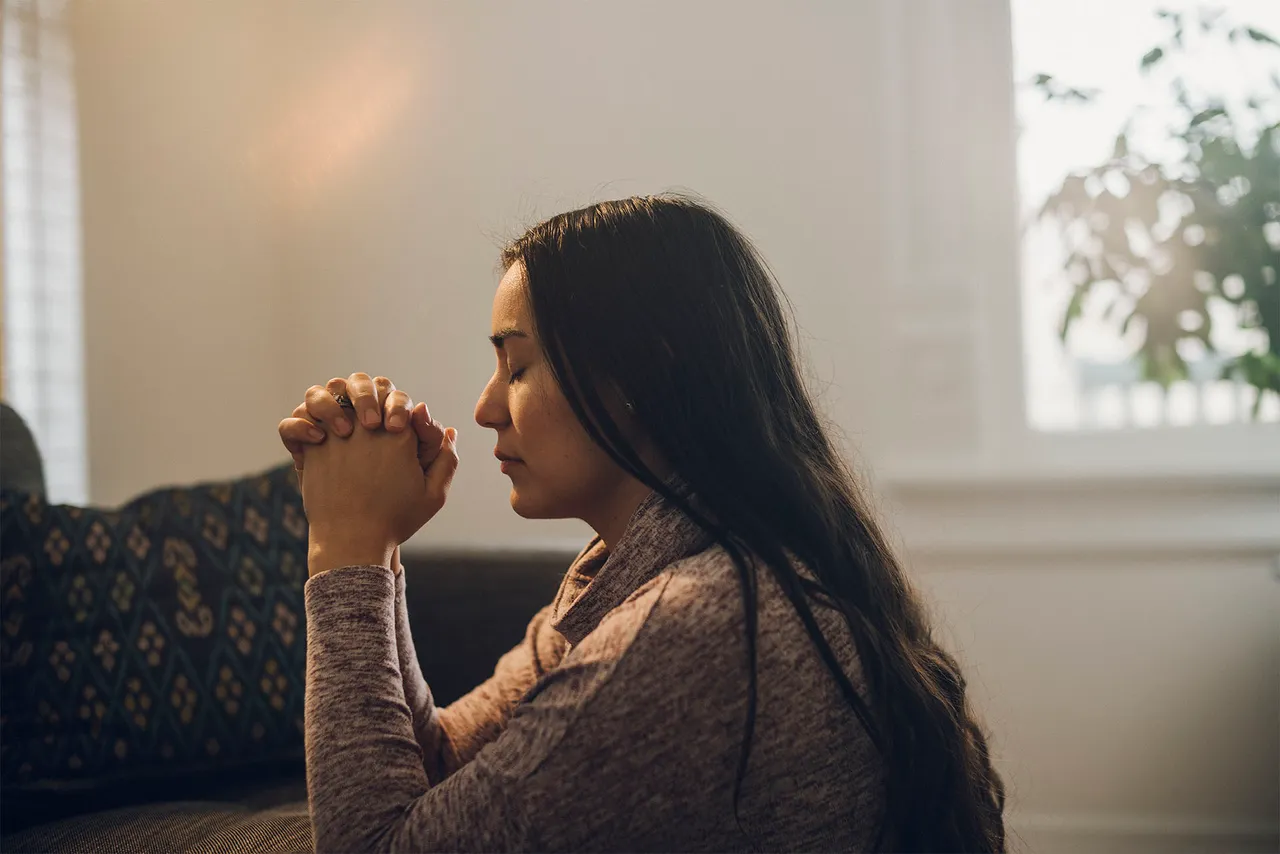 a woman praying