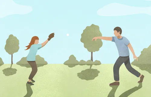 father and daughter playing catch