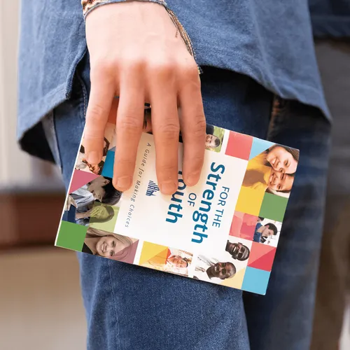 youth carrying For the Strength of Youth guide