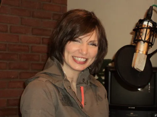 Meg Johnson beside a radio microphone.