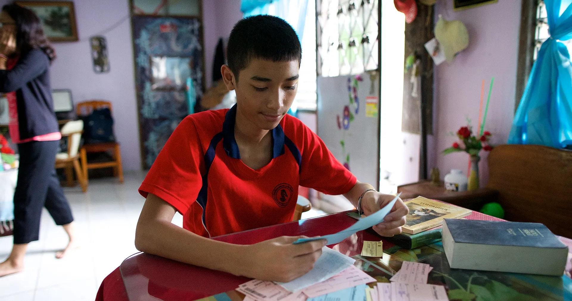 Young man reviews temple records.