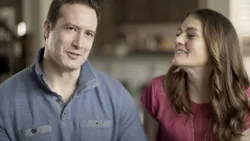 A couple talking to camera