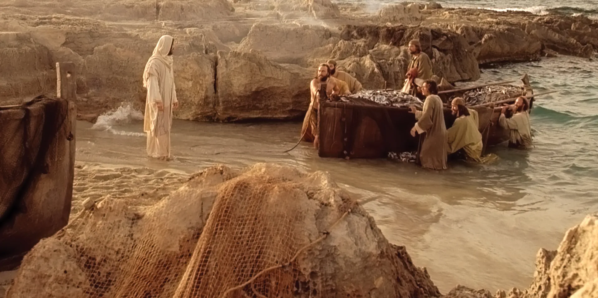 The disciples greet Christ on the shore.