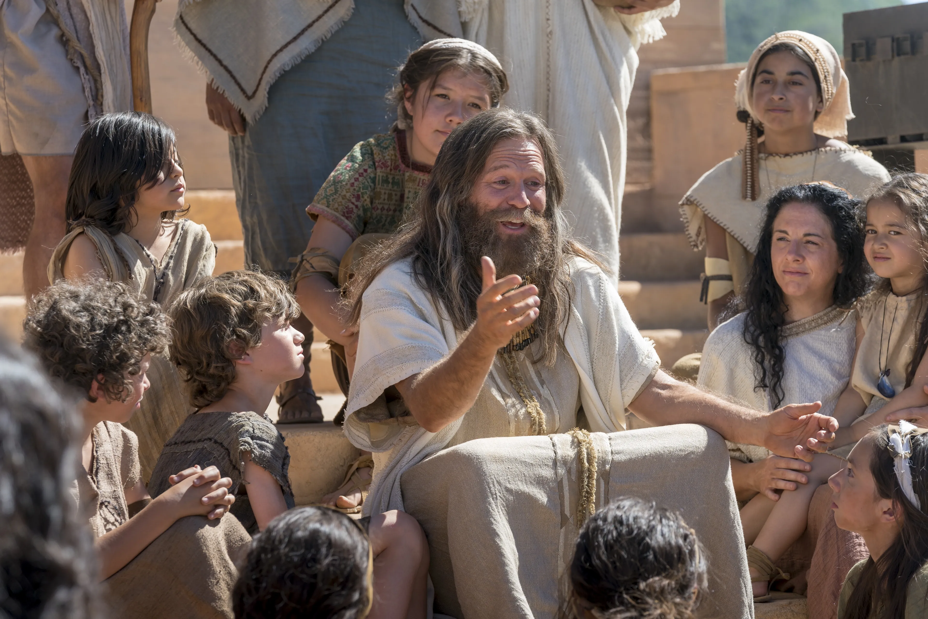 Jacob sits on the steps of the temple as he teaches the Nephites.