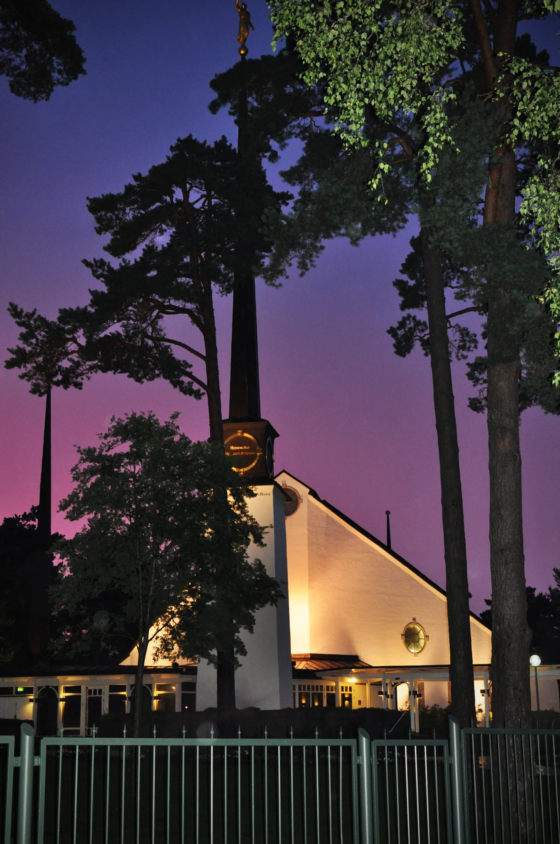 The Stockholm Sweden Temple in the evening, including the entrance and scenery.