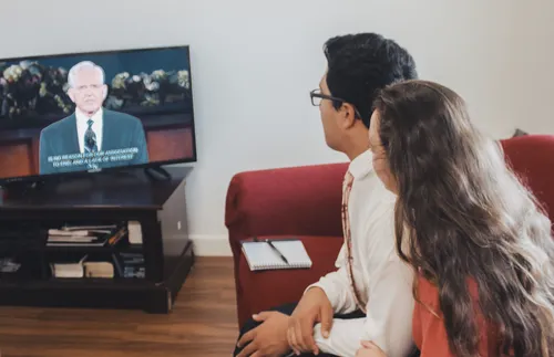 Couple watching general conference
