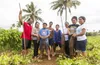 family standing in field