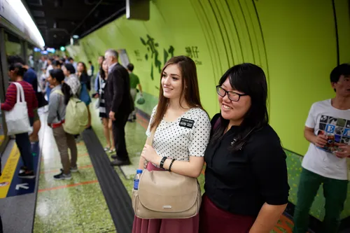 Two sister missionaries prepare to ride the subway in Hong Kong