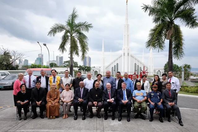Elder Quentin L. Cook of the Quorum of the Twelve Apostles takes a photo with a group of prominent Philippine religious leaders in front of The Church of Jesus Christ of Latter-day Saintsí Manila Philippines Temple on Monday, January 13, 2020.