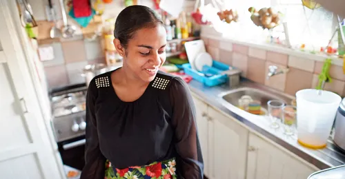 young woman in kitchen
