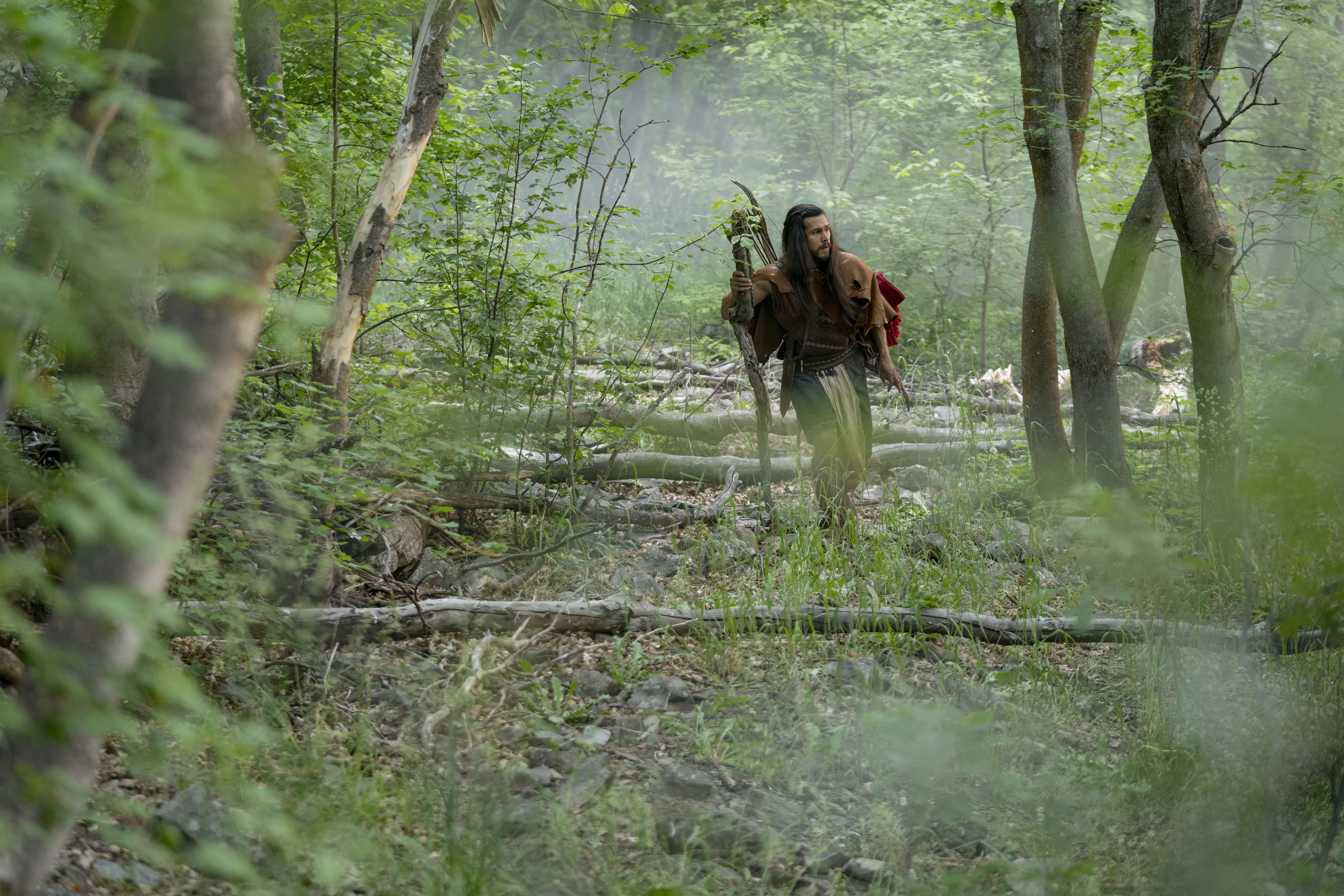 Enos hunts in the woods.