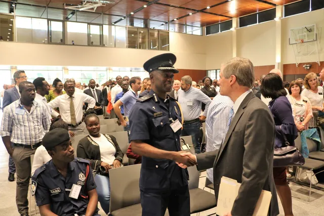 Reverend Father George Arthur, Chaplain General of the Ghana Police, greets Elder Bednar after the MTC dedication October 24, 2017.