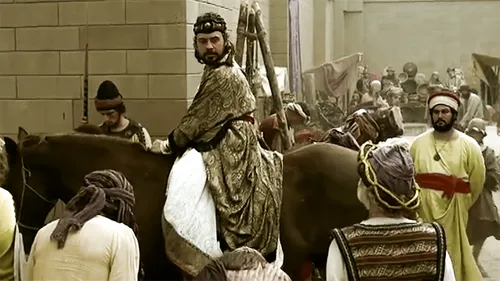 Mordecai watching Haman ride through the streets on a horse