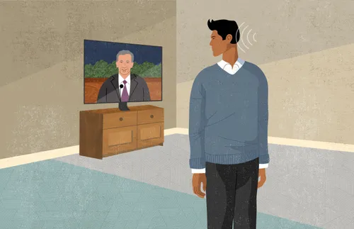 man looking over shoulder at conference on television