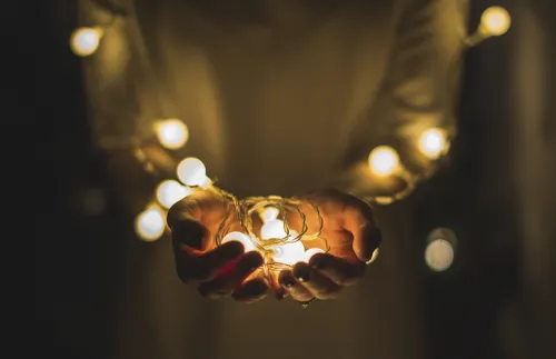 Hands holding lights
