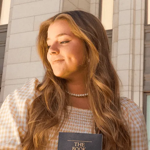young woman with Book of Mormon