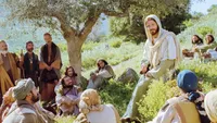 Luke 12:13–34, Listeners sit around Jesus on a hill