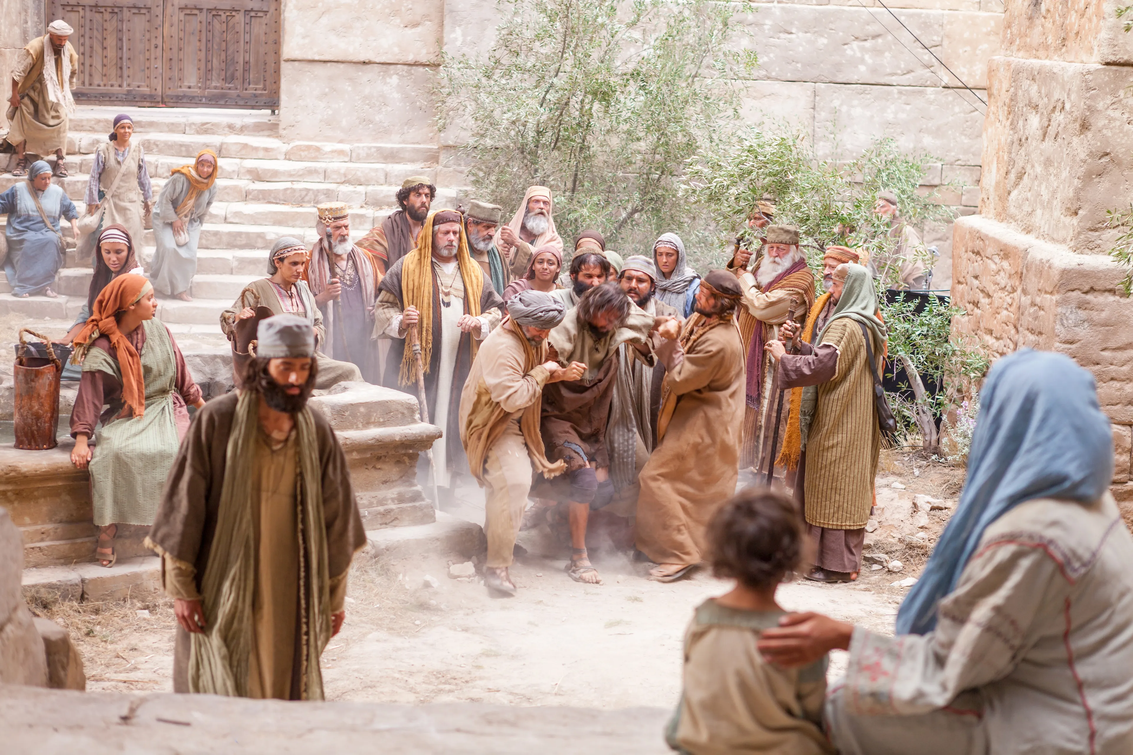 Spectators bring a man with a devil to Christ to cast the devil out of him.