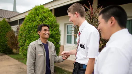 missionaries talking to man