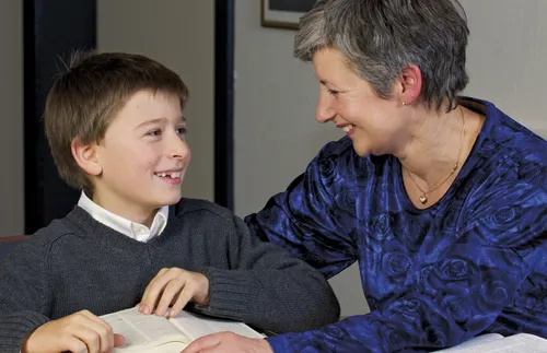 woman and boy at table