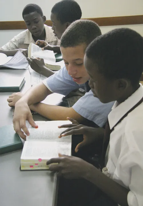 young men reading scriptures