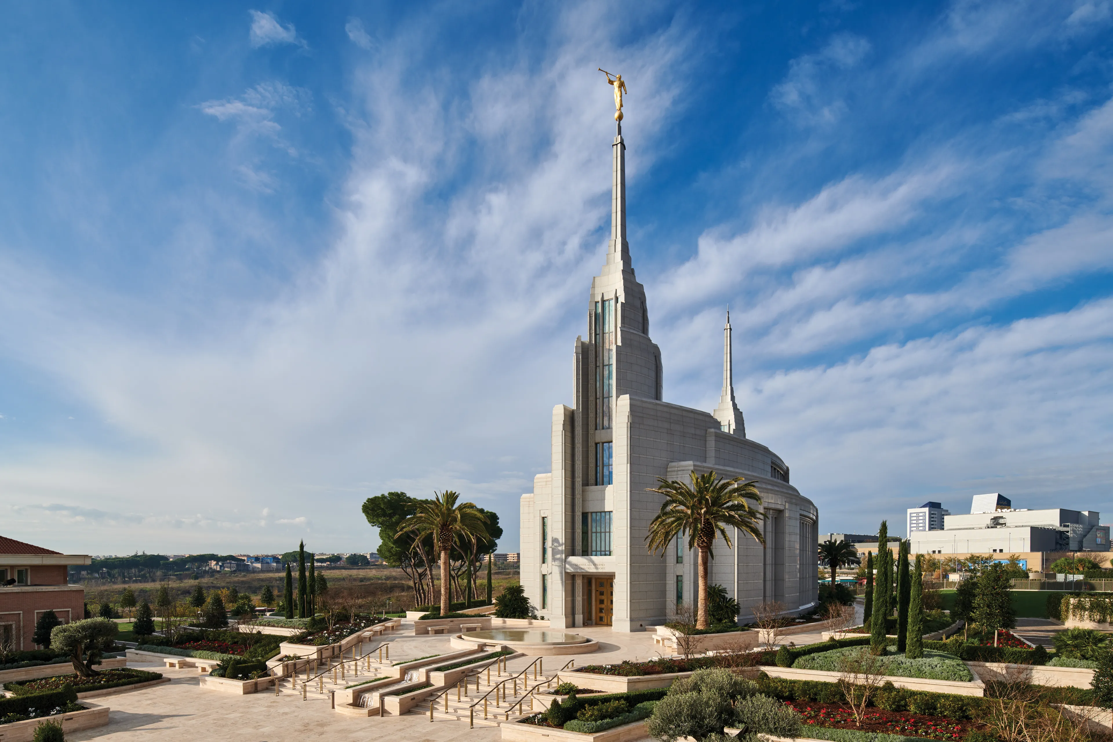 The Rome Italy Temple grounds and surrounding city during the day.