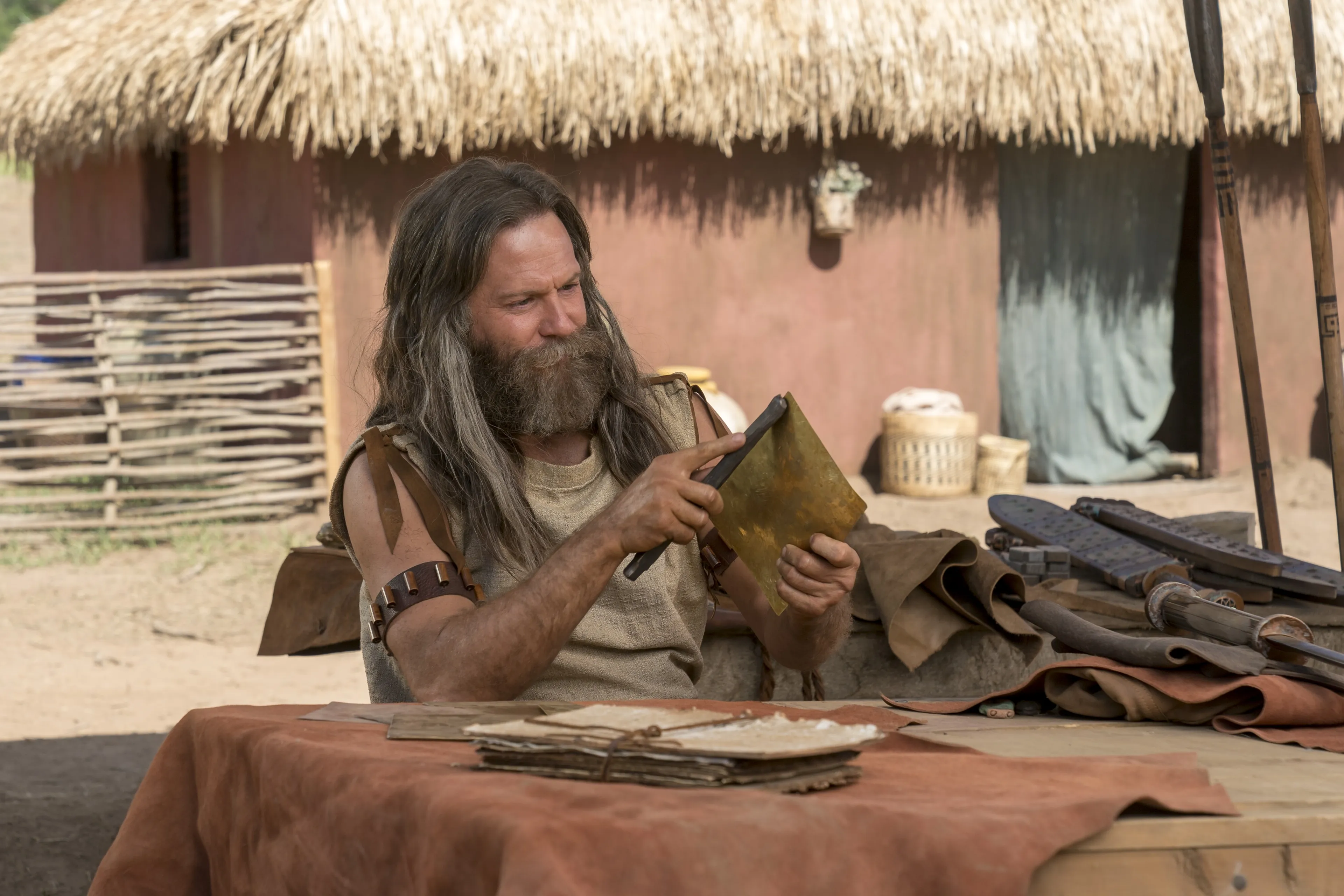 Jacob creates metal plates.