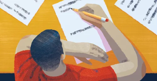 young man taking test in school