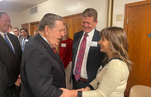 Elder Jeffrey R. Holland greeting members