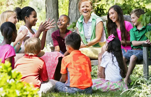 Woman sitting with children