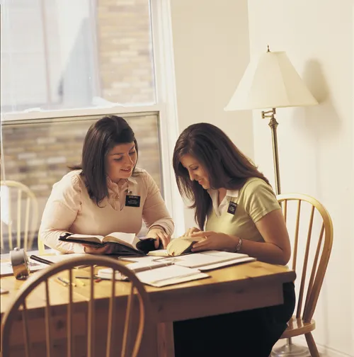 two sisters studying