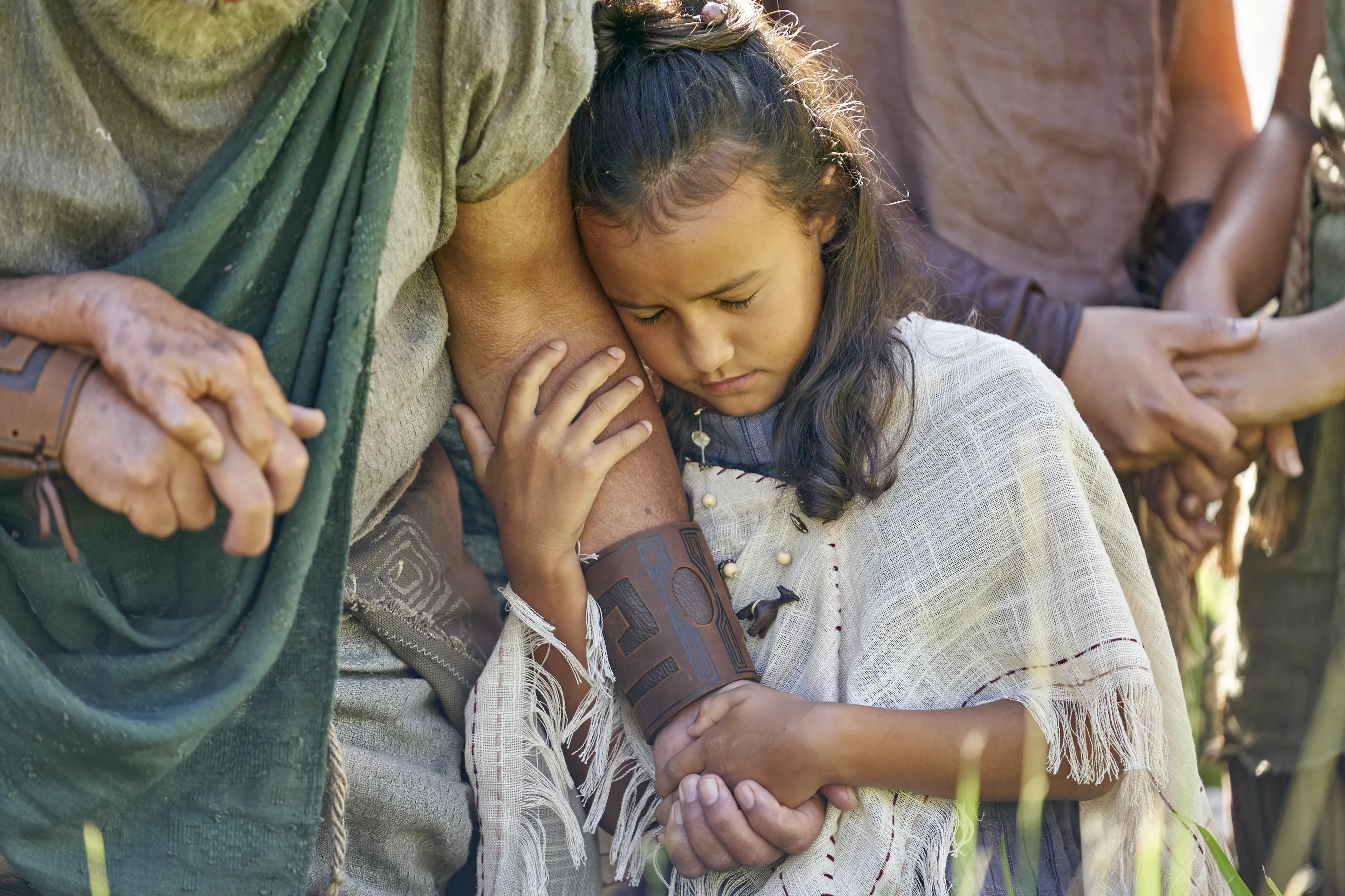 Men and women gather to listen to King Benjamin in the Land of Zarahemla.