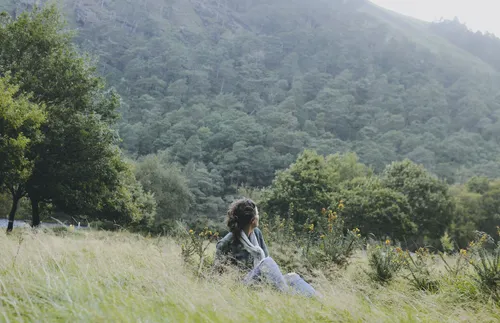 Woman sitting in field