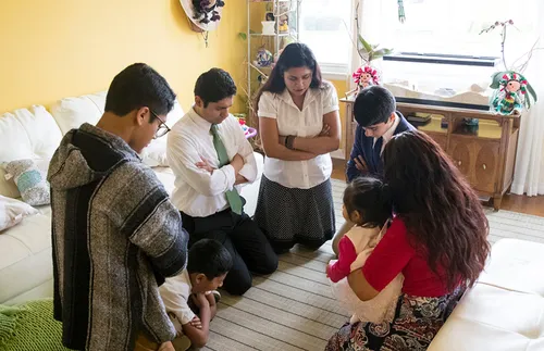 family praying