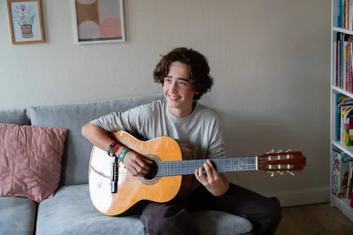 young man playing guitar