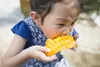 kid eating mango