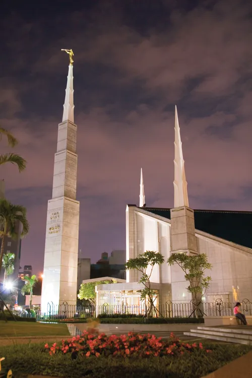 The entrance of the Taipei Taiwan Temple, with a partial view of the grounds, lit up at night.