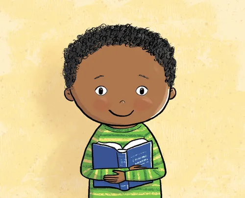 Smiling boy holding the scriptures