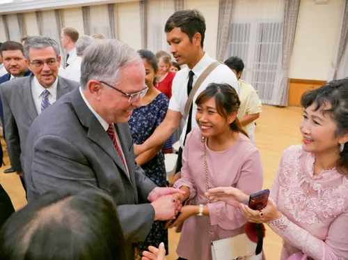 Elder Andersen shaking hands with members