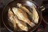 pan with fish frying