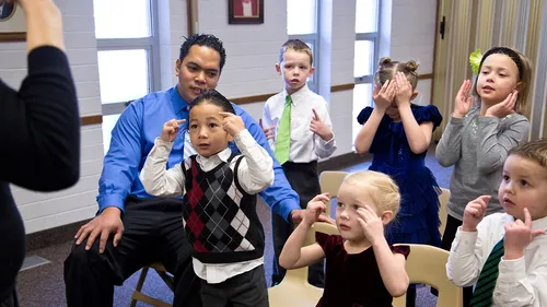 children singing with chorister