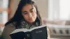 young woman reading Bible
