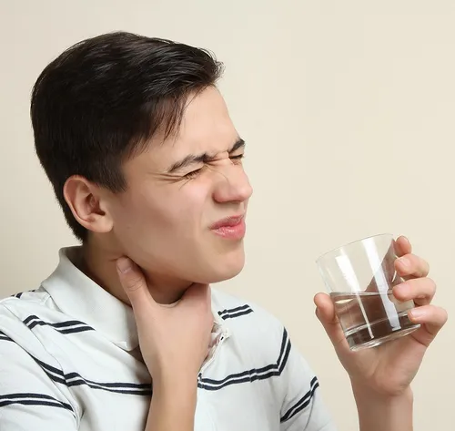 man with sore throat