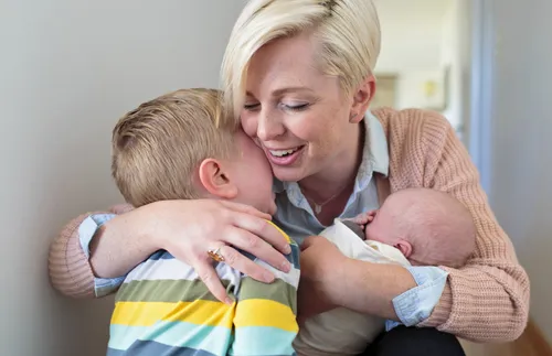 mother with baby and crying child
