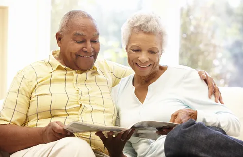 old couple reading magazine