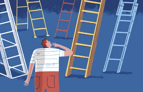 man looking up at ladders