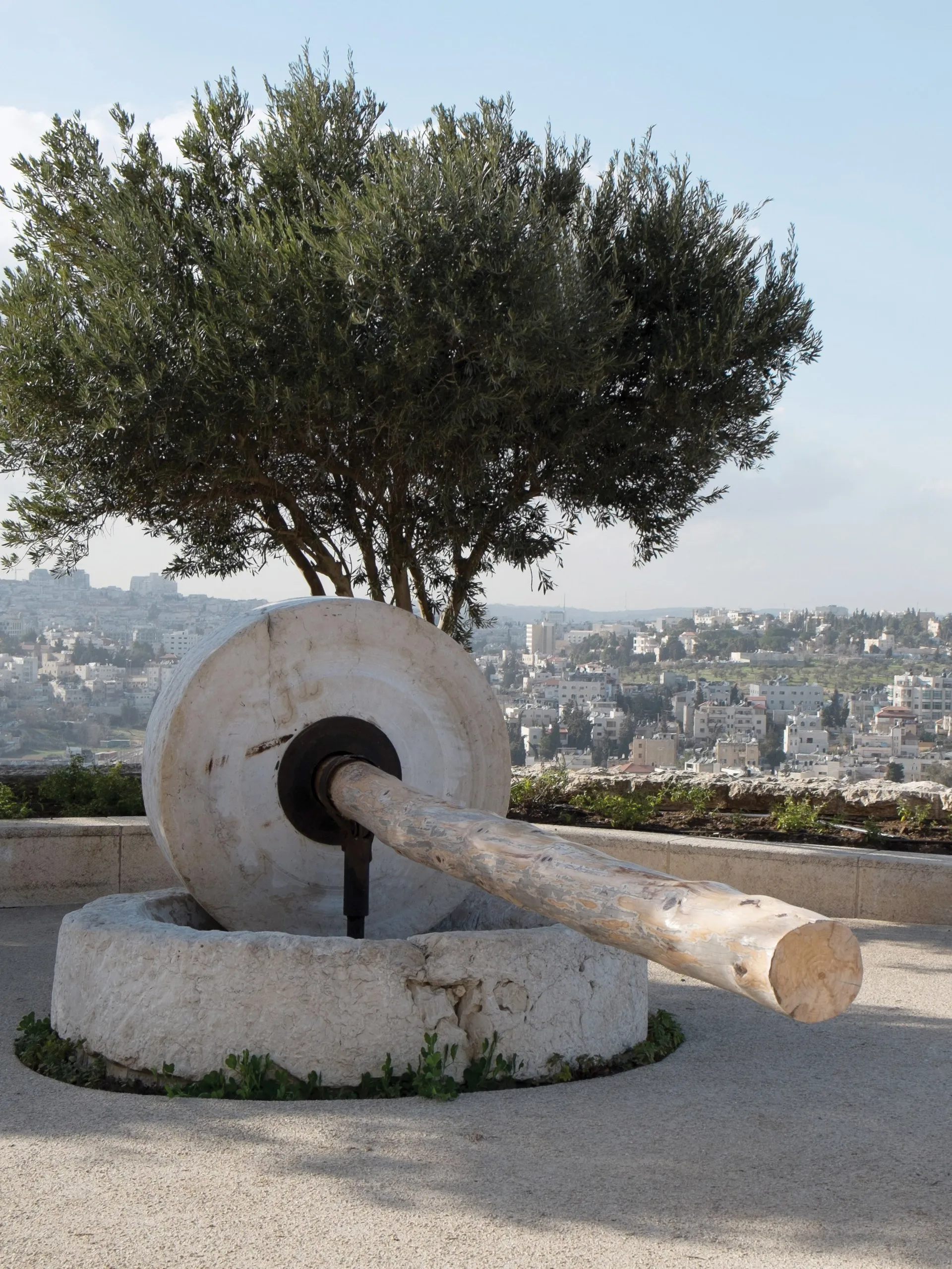 A large stone olive press.