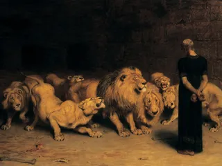 Daniel standing before a group of lions