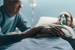 A man visits his wife in the hospital