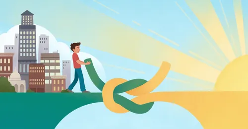 young man by a large knot tying two ends of a bridge together